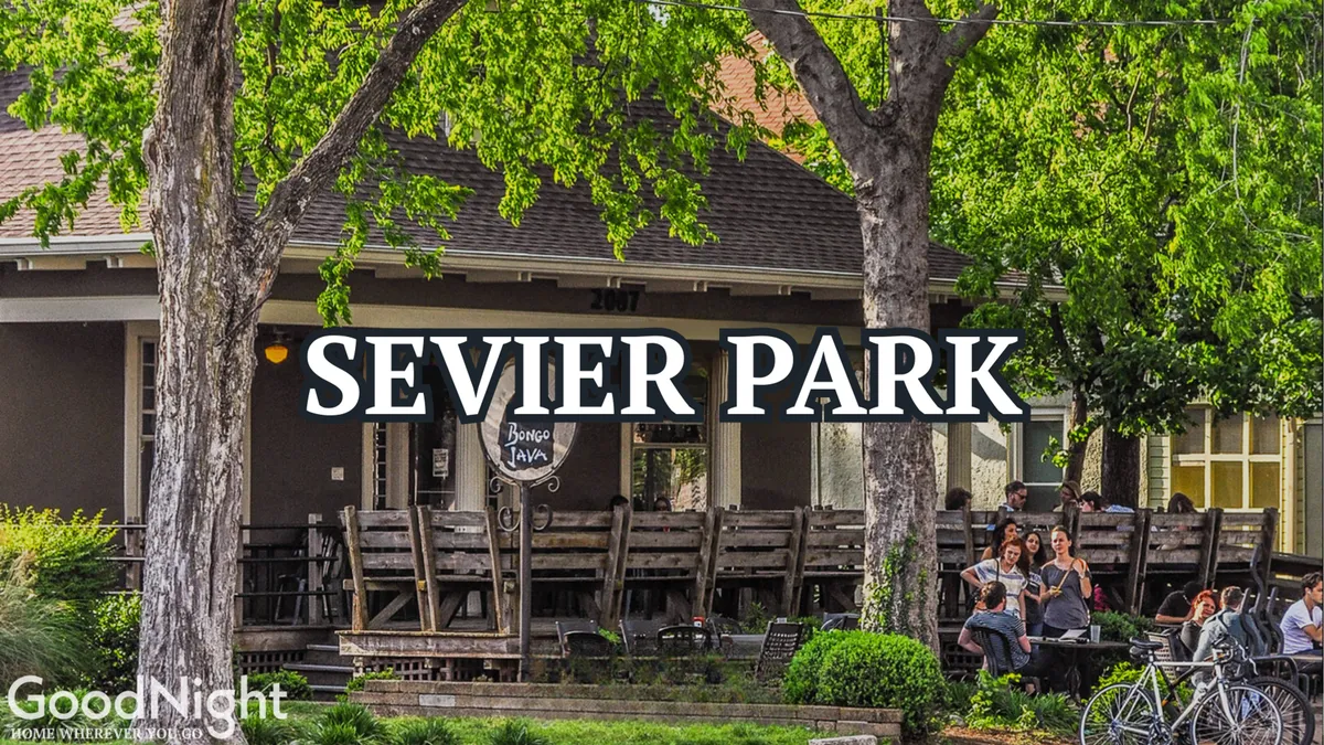 This image features a spacious outdoor seating area at Bonge Tavern, with people enjoying themselves amidst trees and a park-like setting. The atmosphere is lively yet relaxed, ideal for social gatherings or al fresco dining. There’s a sense of community, with groups mingling and celebrating under open skies.